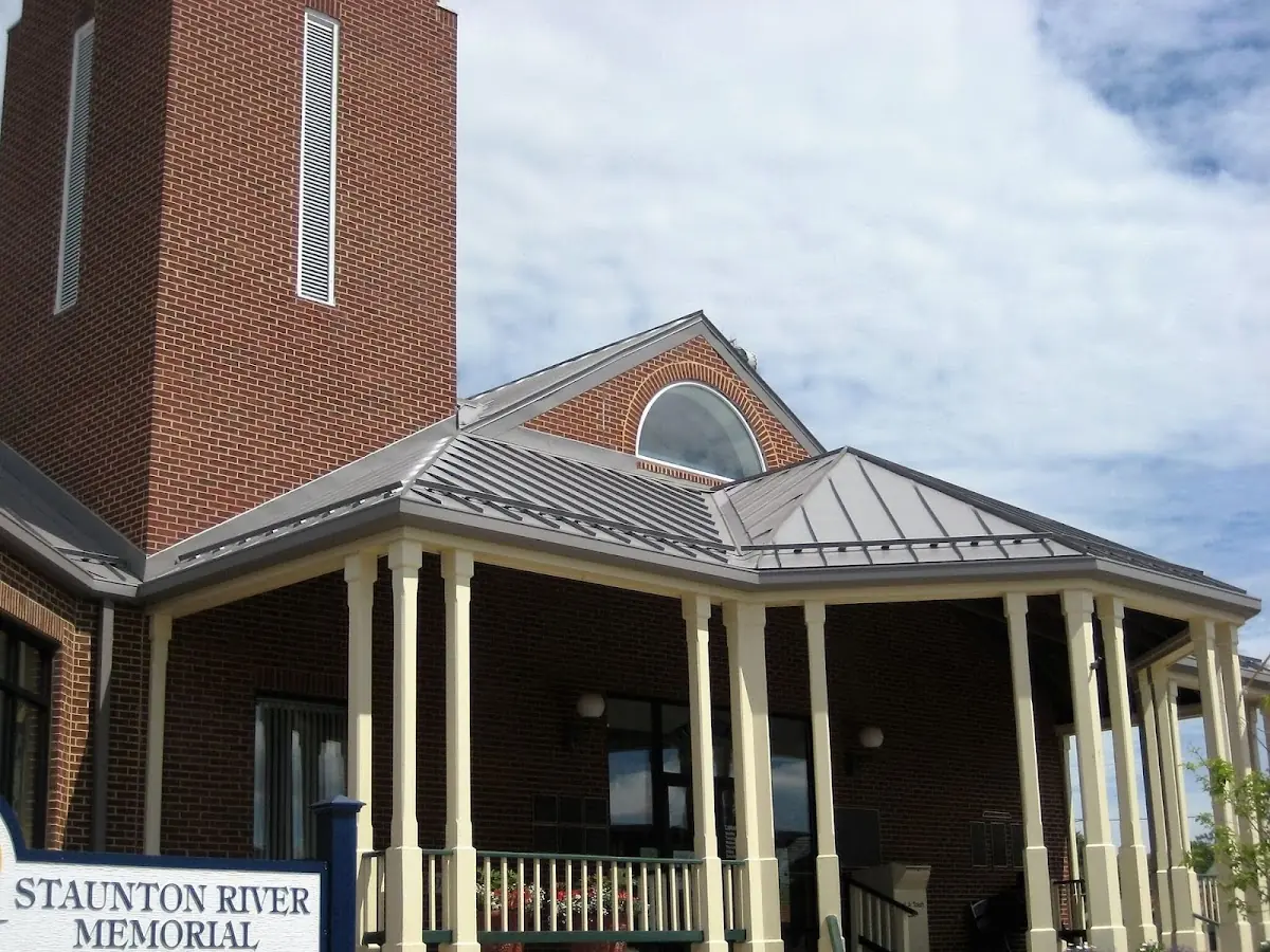 Skilled roofing craftsmen working on a residential roof in Woodbridge